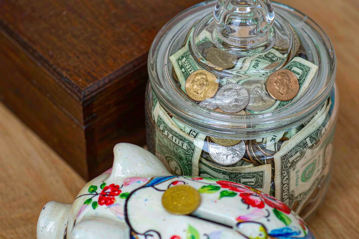 Piggy bank and jar of coins