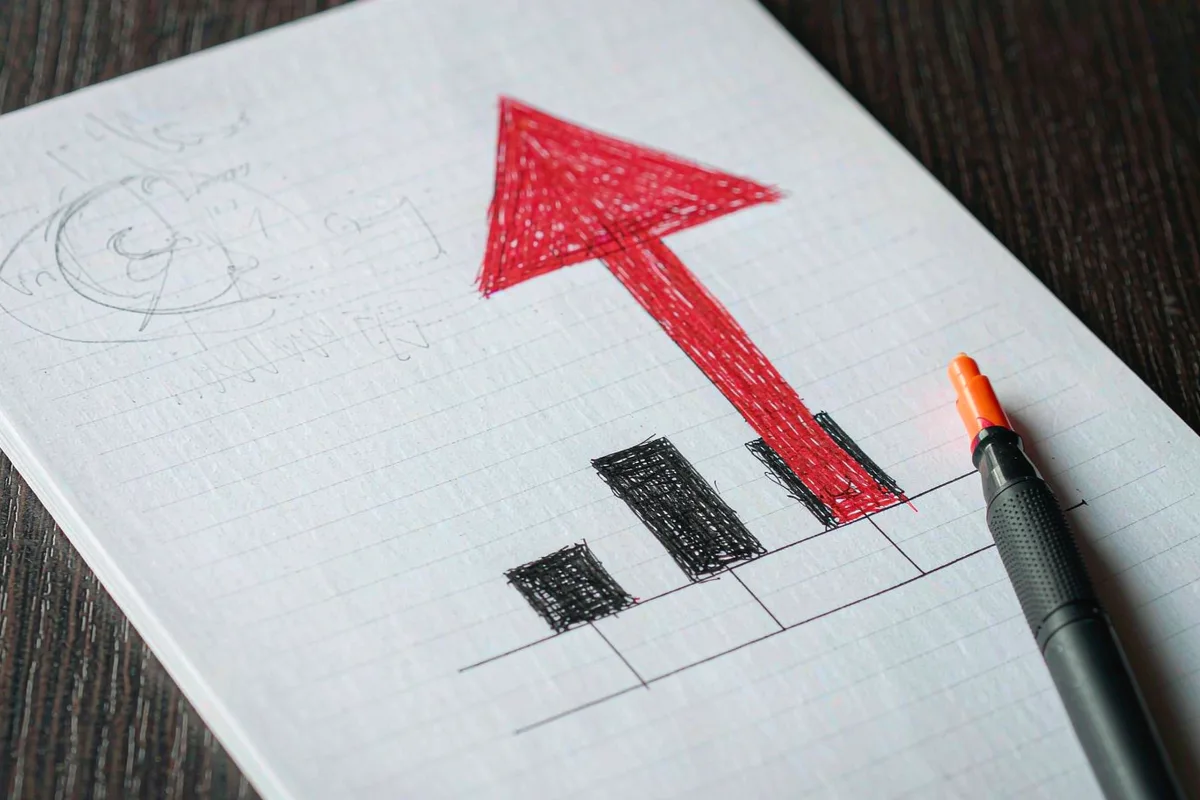 Notebook with a hand-drawn growth arrow