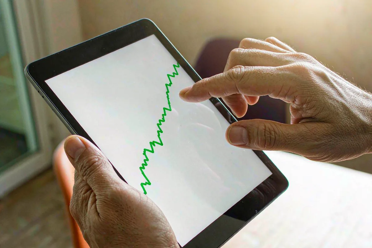 Tablet showing a rising stock chart